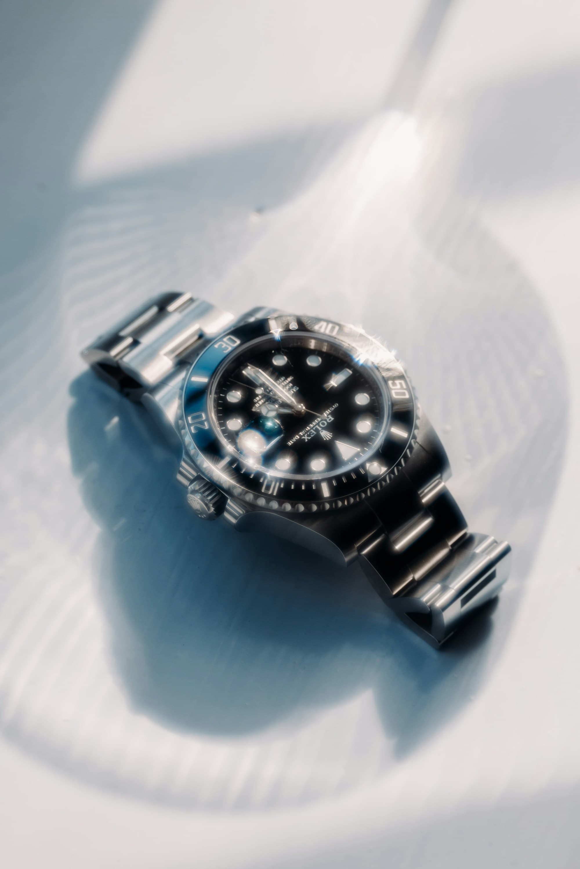 Rolex Submariner under catalogue review lighting