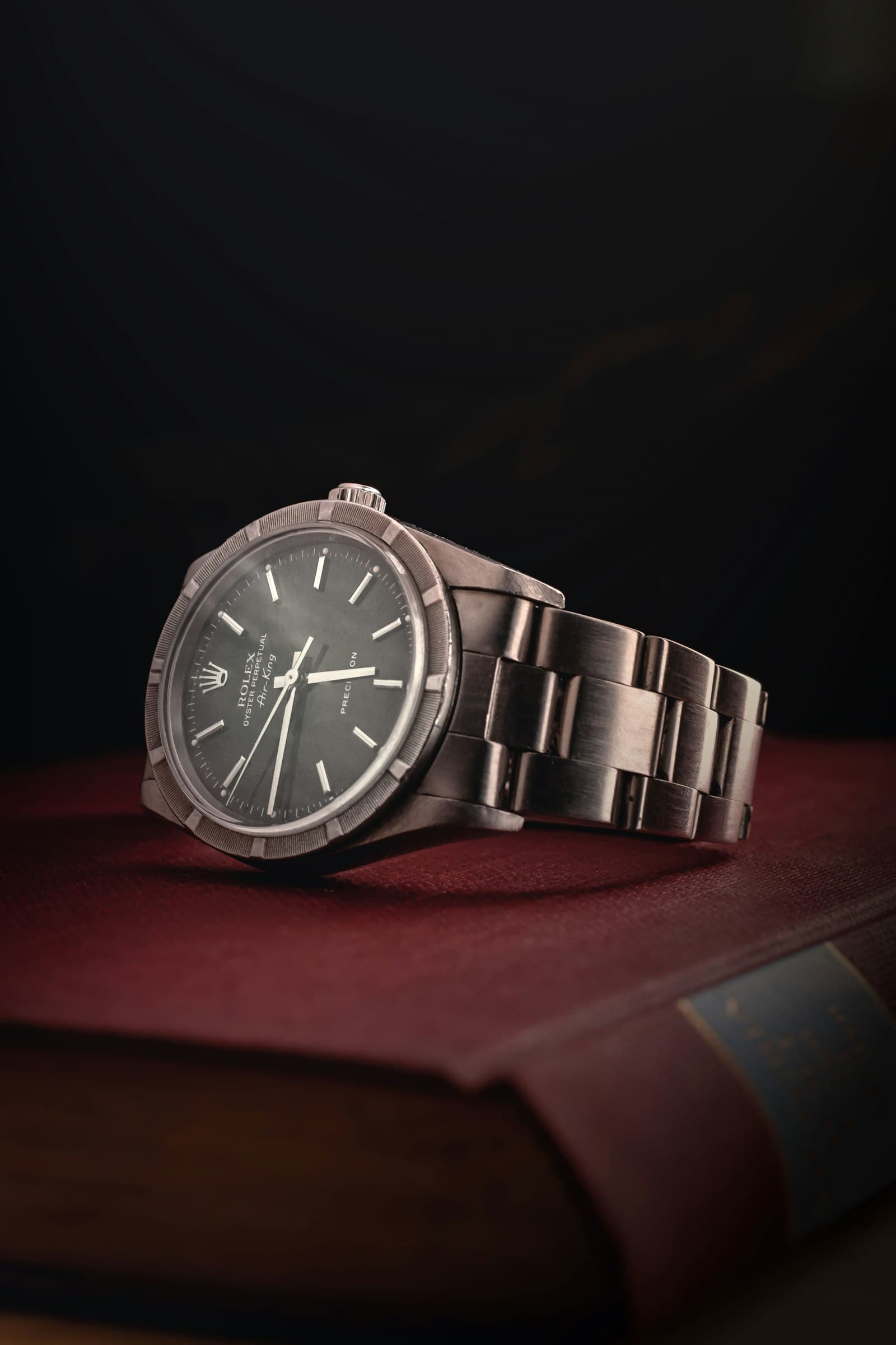 Luxury wristwatch used to illustrate bidding and fee totals